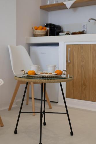 a table with oranges on it in a kitchen at Kastraki Riviera in Kastraki Naxou