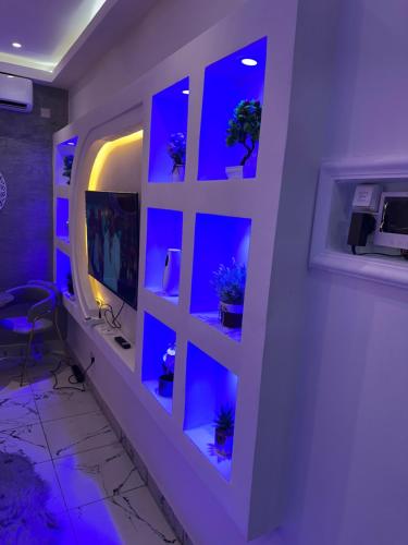 Una televisión o centro de entretenimiento en Bliss Home Residence