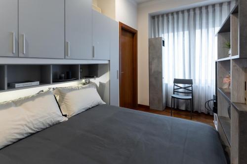 a bedroom with a large bed and a television at Il Piccolo Etrusco-Centro Storico in Arezzo