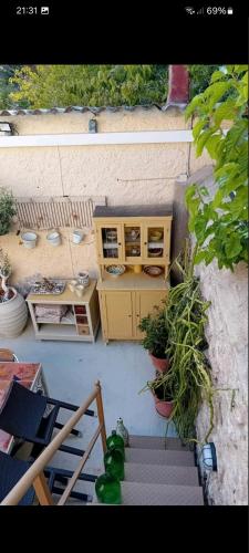 an overhead view of a patio with a counter and plants at Areti's Captain's House with Private Terrace in Galaxidhion