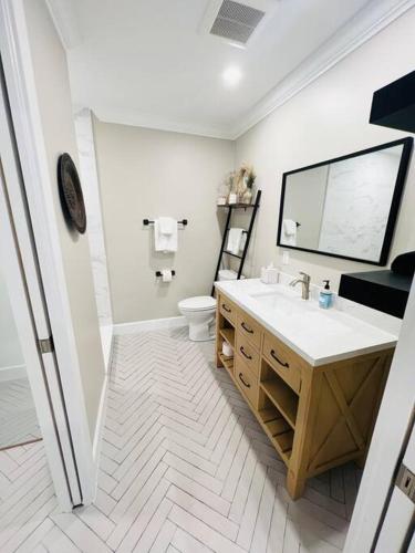 a bathroom with a sink and a toilet at Lovely Studio In Downtown Stuart - Renovated #6 in Stuart