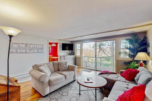 a living room with two couches and a table at Briarcliff G34 in Sugar Mountain