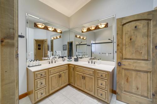 a bathroom with two sinks and a large mirror at Stunning Sedona Views Spa, Firepit and Stargazing in Sedona