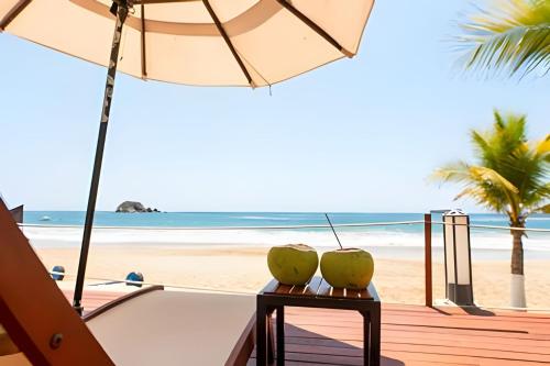 two apples on a table on the beach at BVG ixtapa in Ixtapa