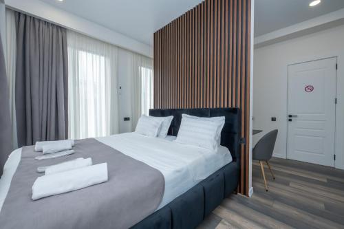 Ένα ή περισσότερα κρεβάτια σε δωμάτιο στο M&N Hotel