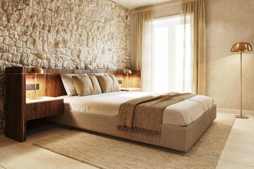 a bedroom with a large bed and a window at Santa Boka in Perast