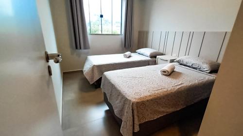 Postel nebo postele na pokoji v ubytování Apartamento a 500mt do mar, perto do Beto Carrero, com ar condicionado