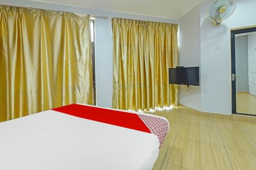 Postel nebo postele na pokoji v ubytování Hotel O Purple Town