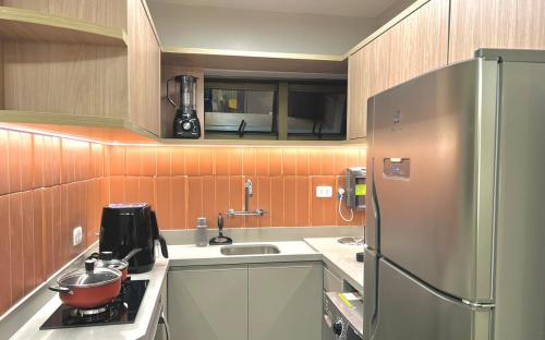 O bucătărie sau chicinetă la 1001A - Rentaqui Apartamento Diamond Green