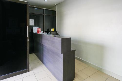 a lobby with a counter in a building at Hotel O 365 Nice Stay in Miri