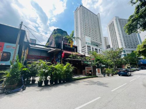 a street in a city with tall buildings at Hotel O I.villa Inn in Kuala Lumpur