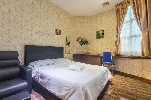 Katil atau katil-katil dalam bilik di Hotel O Rebecca's Homes