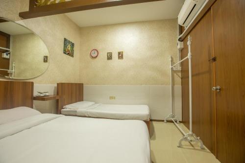 Katil atau katil-katil dalam bilik di Hotel O Rebecca's Homes