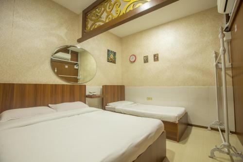 Katil atau katil-katil dalam bilik di Hotel O Rebecca's Homes