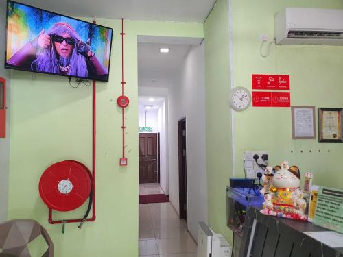 TV a/nebo společenská místnost v ubytování OYO 91053 Signature Inn Miri