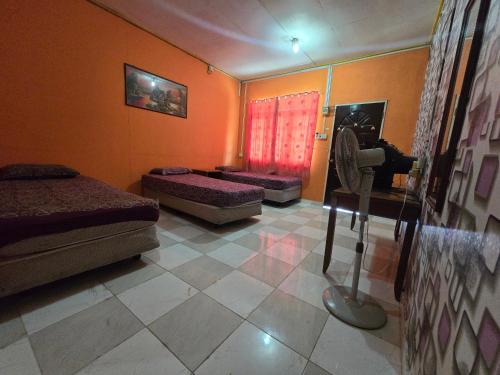 Gallery image of Hotel O Kamal Guest House Marang in Kampong Kijing