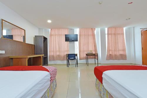 Hotel O Sam Huat Hotelにあるベッド