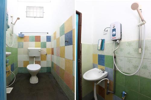 a bathroom with a toilet and a sink at Hotel O Innap Kota Bharu in Kota Bharu