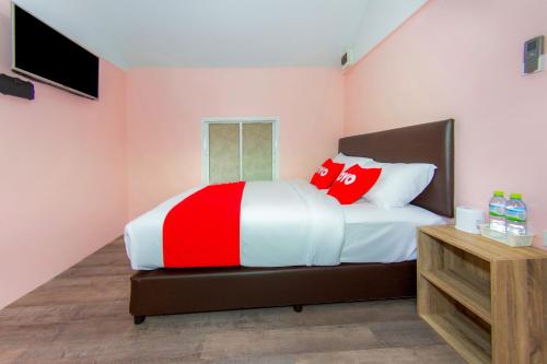 Postel nebo postele na pokoji v ubytování OYO 578 PJ Resort And Snooker Club