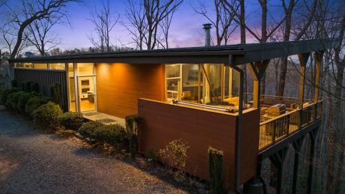 a small house with a roof on a street at Mtn Views Sleeps 8 Hot Tub Game Room Fireplace in Blue Ridge
