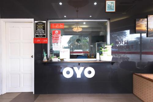 a store front with an oo sign on the front at Hotel O Comfort in Ipoh