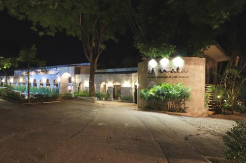a building lit up at night with lights at Capital O 464 At Nata Chiangmai Chic Jungle in Mae Rim