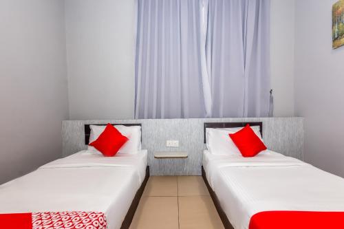 Postel nebo postele na pokoji v ubytování OYO 1185 Ho Hotel