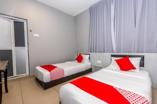 Postel nebo postele na pokoji v ubytování OYO 1185 Ho Hotel