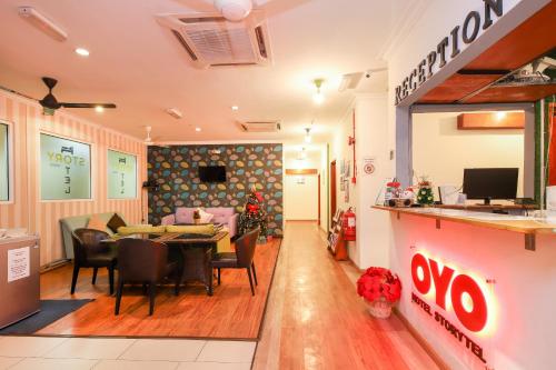 a dining room with a table and chairs at Hotel O Storytel in Kota Kinabalu