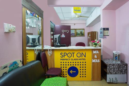 a store with a pop up sign in a room at Hotel O Perfect Class Hotel in Kuala Lumpur