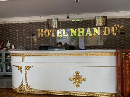 a bar in a restaurant with a sign that reads hotel man bureau at Nhan Duc Hotel in Ho Chi Minh City