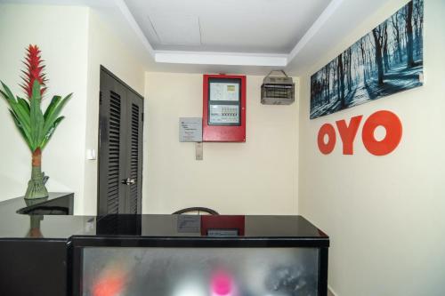 a tv in a room with a fish tank at Hotel O Stay Inn Ii in Kota Kinabalu