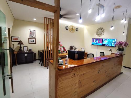 a bar in a salon with a counter at Hotel O Pavilion Inn Hotel in Lumut