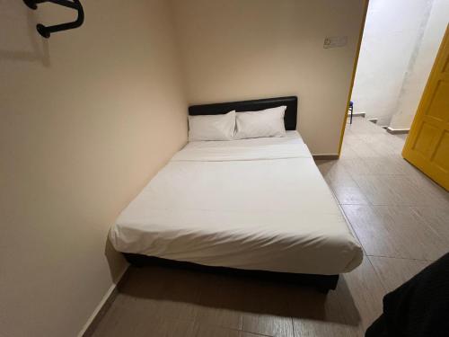 Postel nebo postele na pokoji v ubytování Tampoi Sojourn
