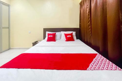 Postel nebo postele na pokoji v ubytování OYO 90369 Safari Hotel Lumut