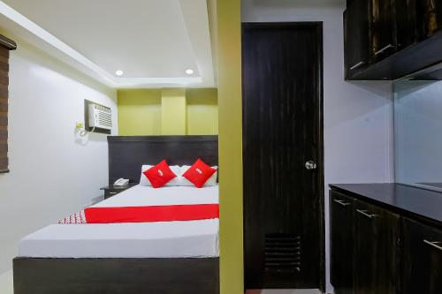 Postel nebo postele na pokoji v ubytování JQV Hotel