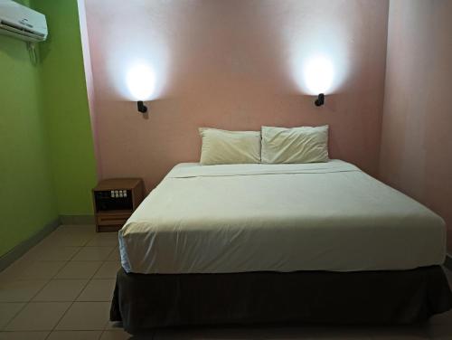 Cama o camas de una habitación en Hotel O Wawasan Inn