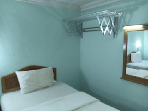 Cama o camas de una habitación en Hotel O Wawasan Inn