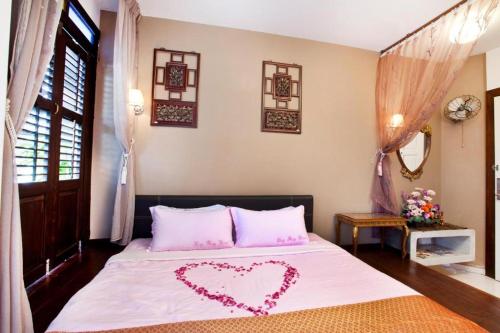 Hotel O Vince Villaにあるベッド