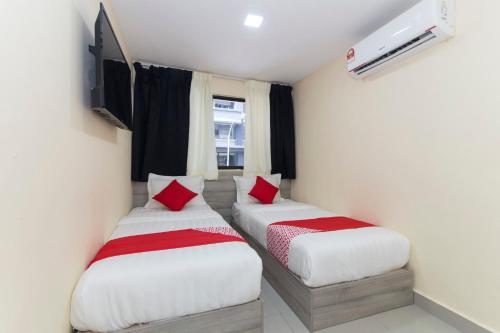 Postel nebo postele na pokoji v ubytování OYO 552 Hotel Kl Centre Point