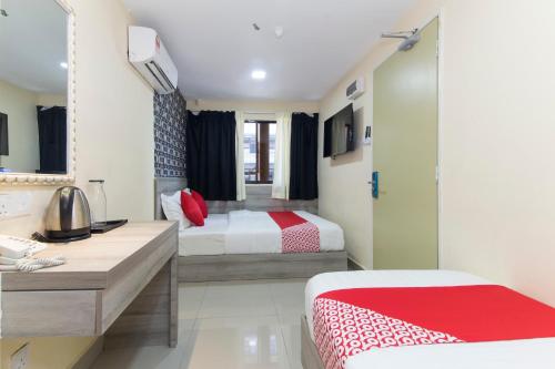 Postel nebo postele na pokoji v ubytování OYO 552 Hotel Kl Centre Point