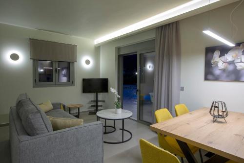 a living room with a couch and a table at Valley House in Vasiliki