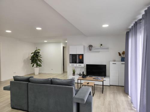a living room with a couch and a table at Azores Blue Bay II in Madalena