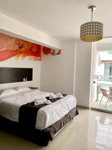 Ένα ή περισσότερα κρεβάτια σε δωμάτιο στο Mochican Palace Hotel