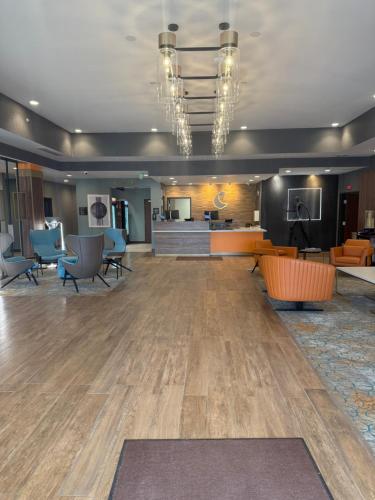a large lobby with chairs and a waiting room at Comfort Suites Cheyenne in Cheyenne