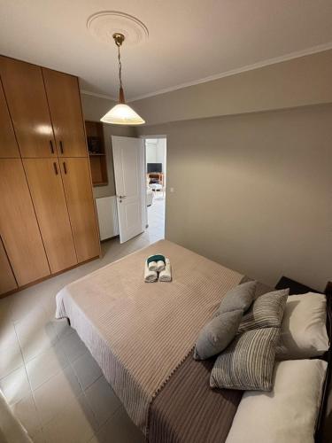 a bedroom with a bed with a hat on it at Apartment 14 Lemnos in Kalliópi