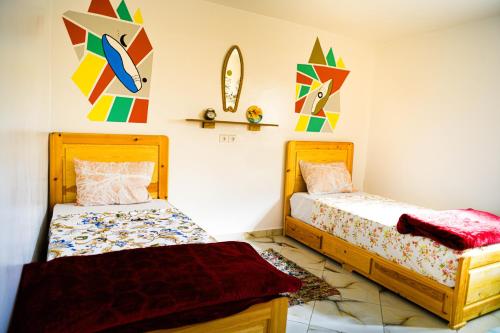 Postel nebo postele na pokoji v ubytování Jungle House imsouane