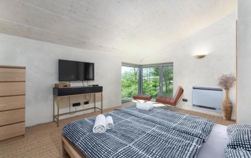 Postel nebo postele na pokoji v ubytování Villa Le Grand Cru