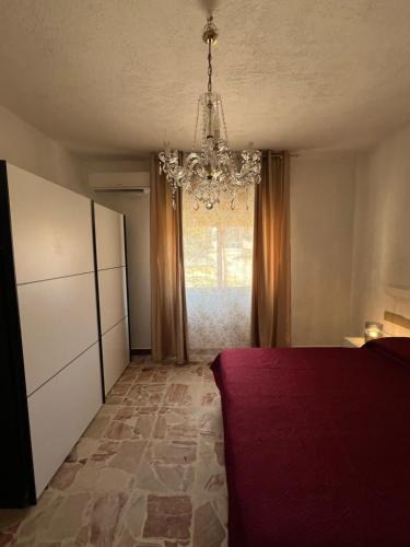 Ένα ή περισσότερα κρεβάτια σε δωμάτιο στο Casa Vacanze Panorama sulle Egadi