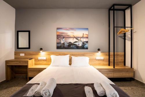 Ένα ή περισσότερα κρεβάτια σε δωμάτιο στο Salty Sea View Apartments